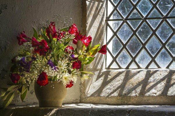 Still life of flowers on a window background