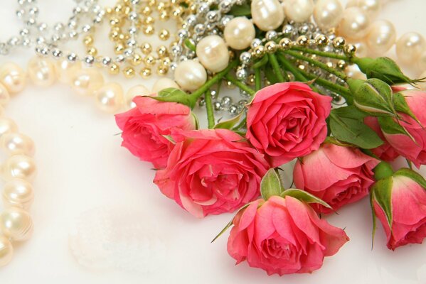 Pearl necklace on a bouquet of roses