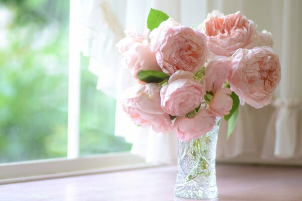 Pink underwater roses in a crystal vase