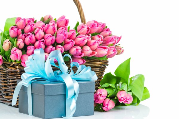 Pink tulips in a basket and a gift