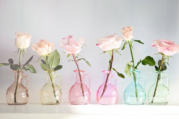 Composition of roses in glass vessels