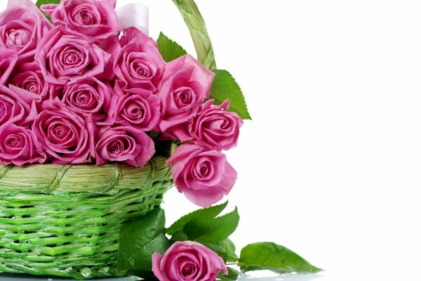 Bouquet of pink roses in a wicker basket