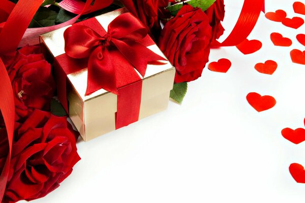 Caja de regalo rodeada de rosas y corazones