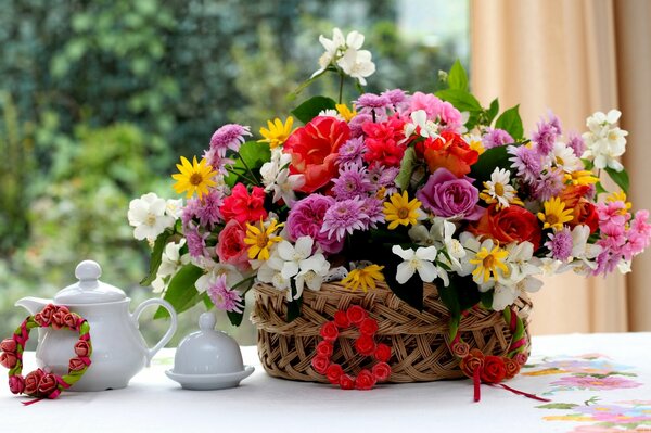 Composition of flowers in a basket on the table