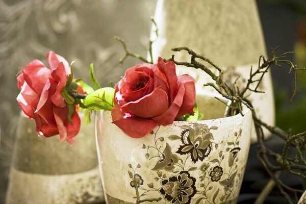 Artificial flowers in a vase with a pattern