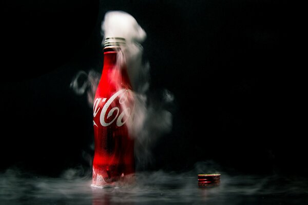 Smoke from the neck of a bottle of Coca-Cola