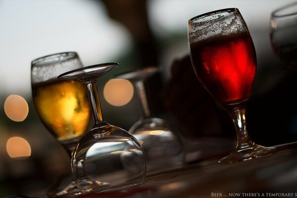 Glasses with colored drinks on the table