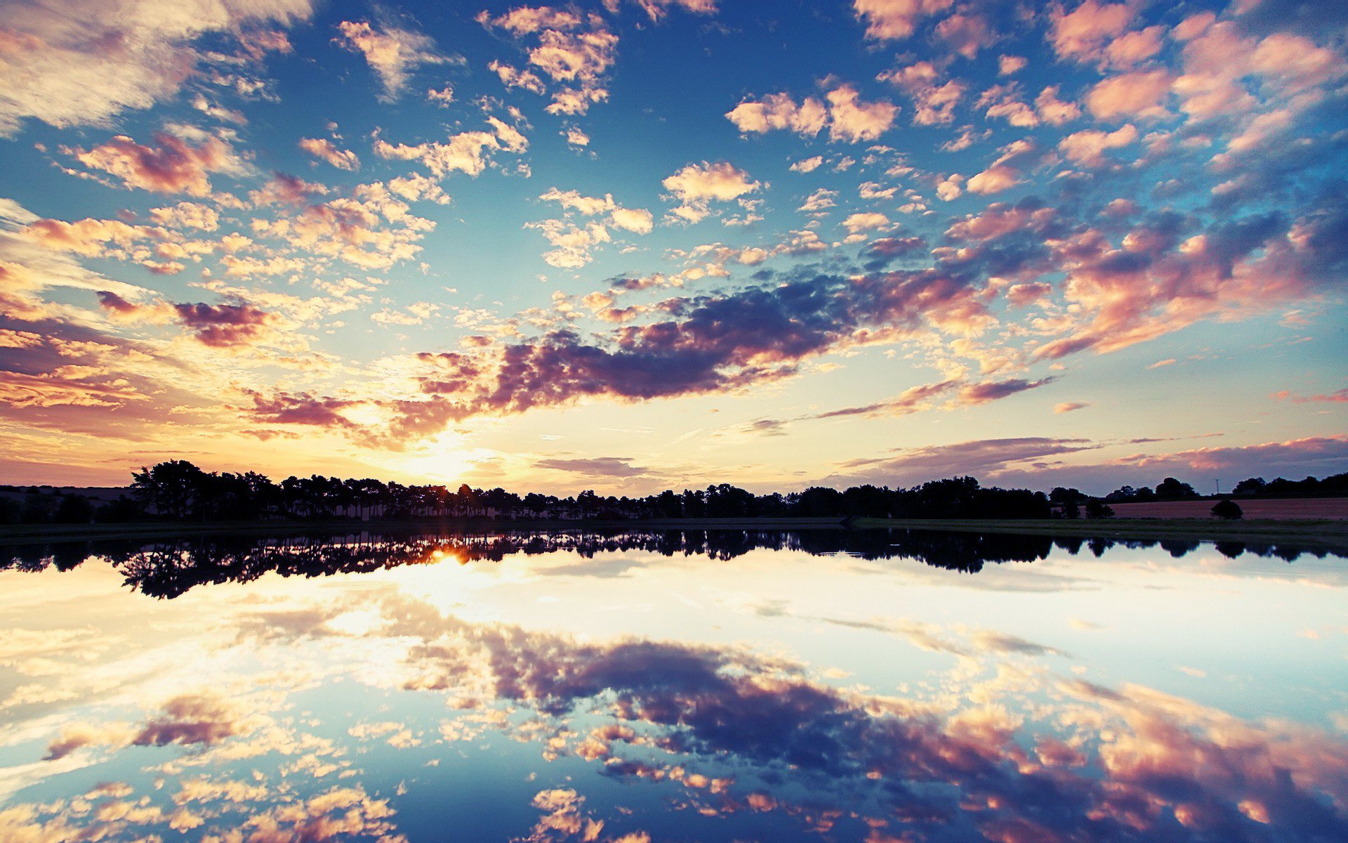 unset clouds sky lake reflection