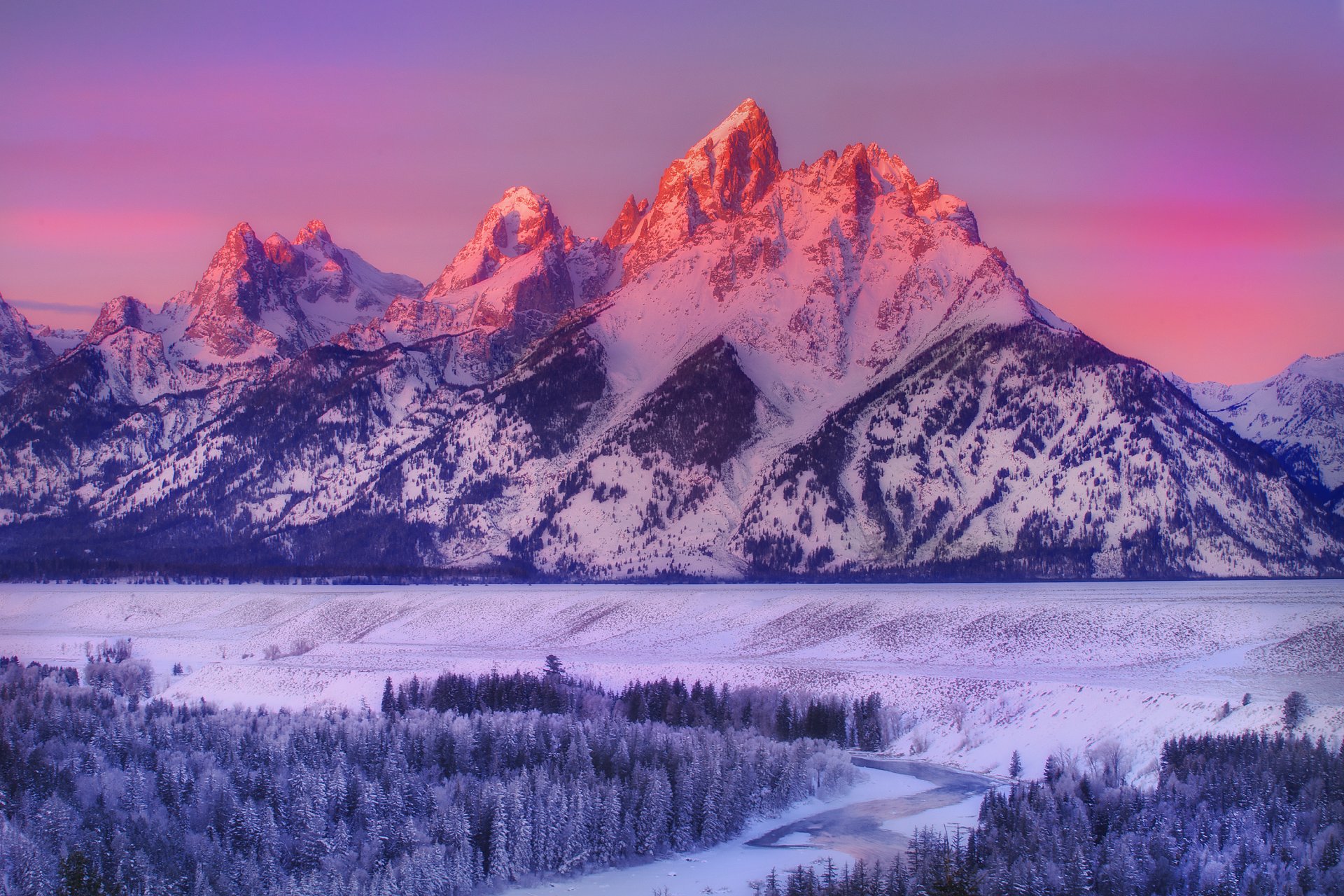 alpenglow en grand teton-serpiente río frente a la calle parque nacional grand teton wyoming montañas parque nacional invierno nieve