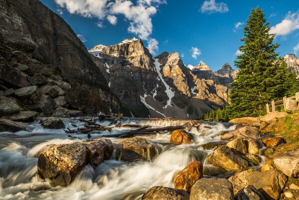 A mountain river pours over the stones