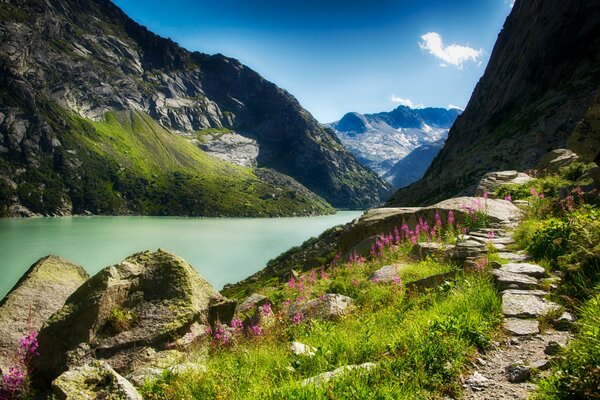 A mountain trail leads to the top. Near the river