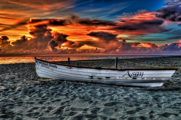 Boat on the beach and sunset