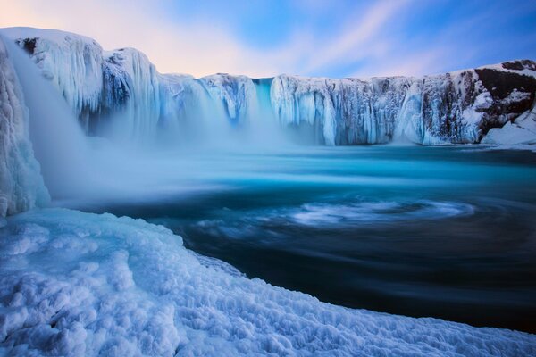 Iceland s nature incredible waterfalls in snowy mountains