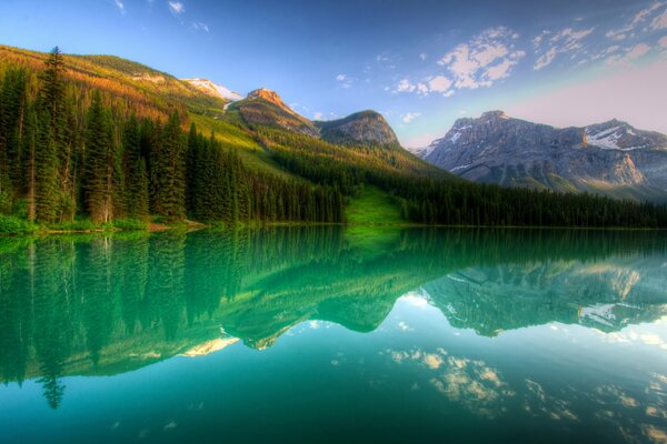 Forest lake on the background of mountains in Canada