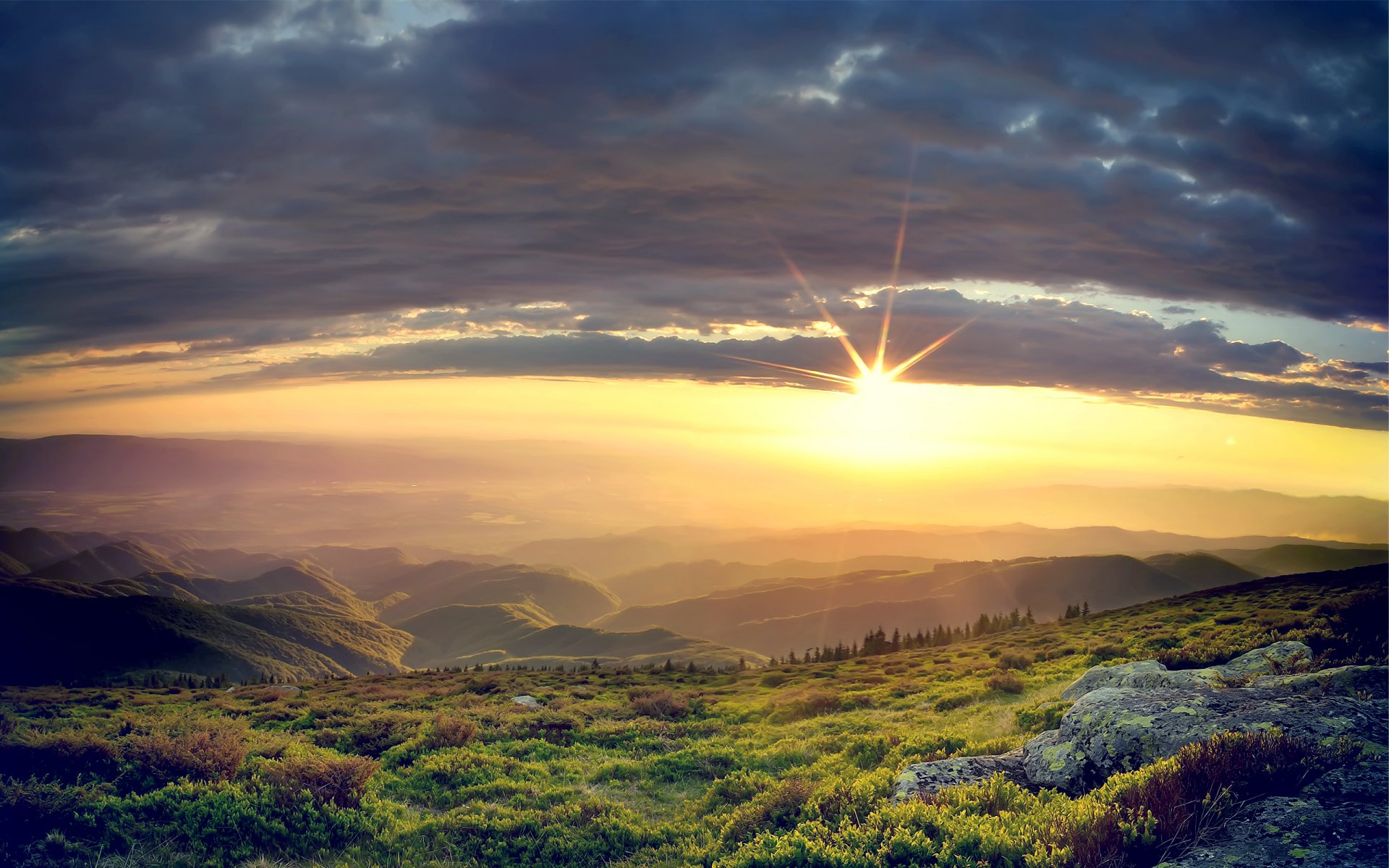 collines coucher de soleil roches herbe nuages pierres