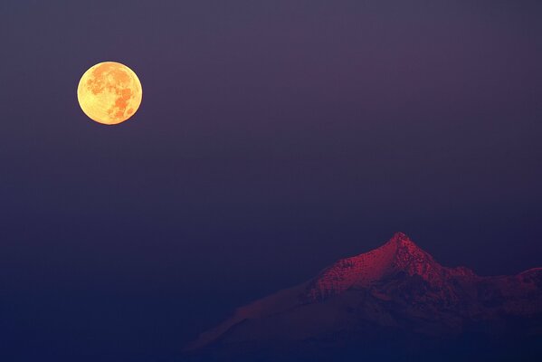 The moon in Italy over the Alps