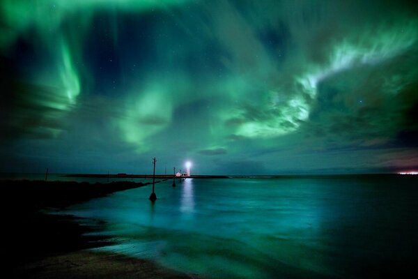 The lighthouse in response to the Northern Lights