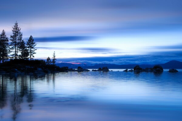 The blue surface of the lake merges with the sky