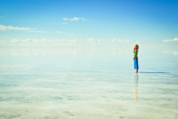 A girl on the background of clear clear ocean water