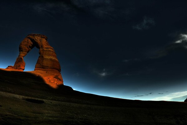 Arch rock sunrise night