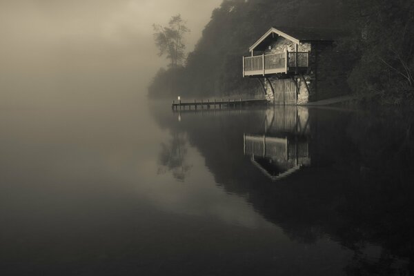 House on the shore in the fog