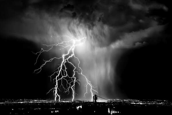 Black and white photo of the sky with lightning