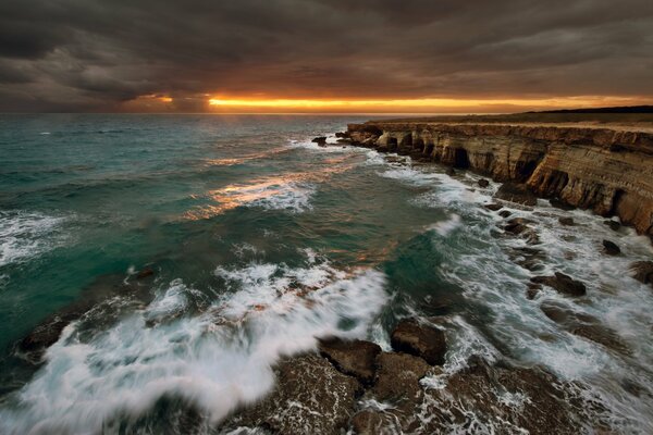 Sunset on the rocky seashore