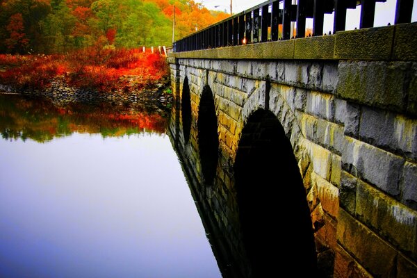 Stone bridge in autumn Park