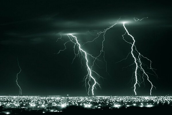 Lightning flashes at night over the river