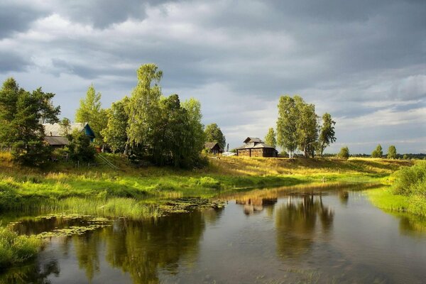 A house in the village on the river bank