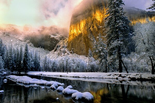 Winter landscape by a mountain river