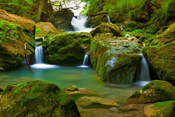 Lakes with mini waterfalls and mossy stones