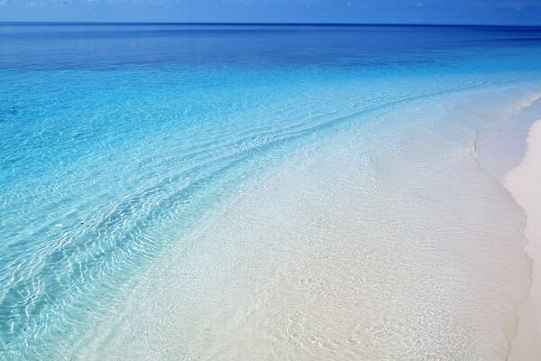 Clean water, golden sand