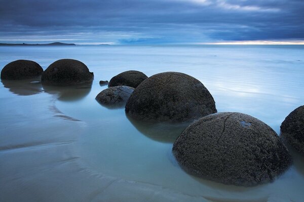 Sea boulders at sunset