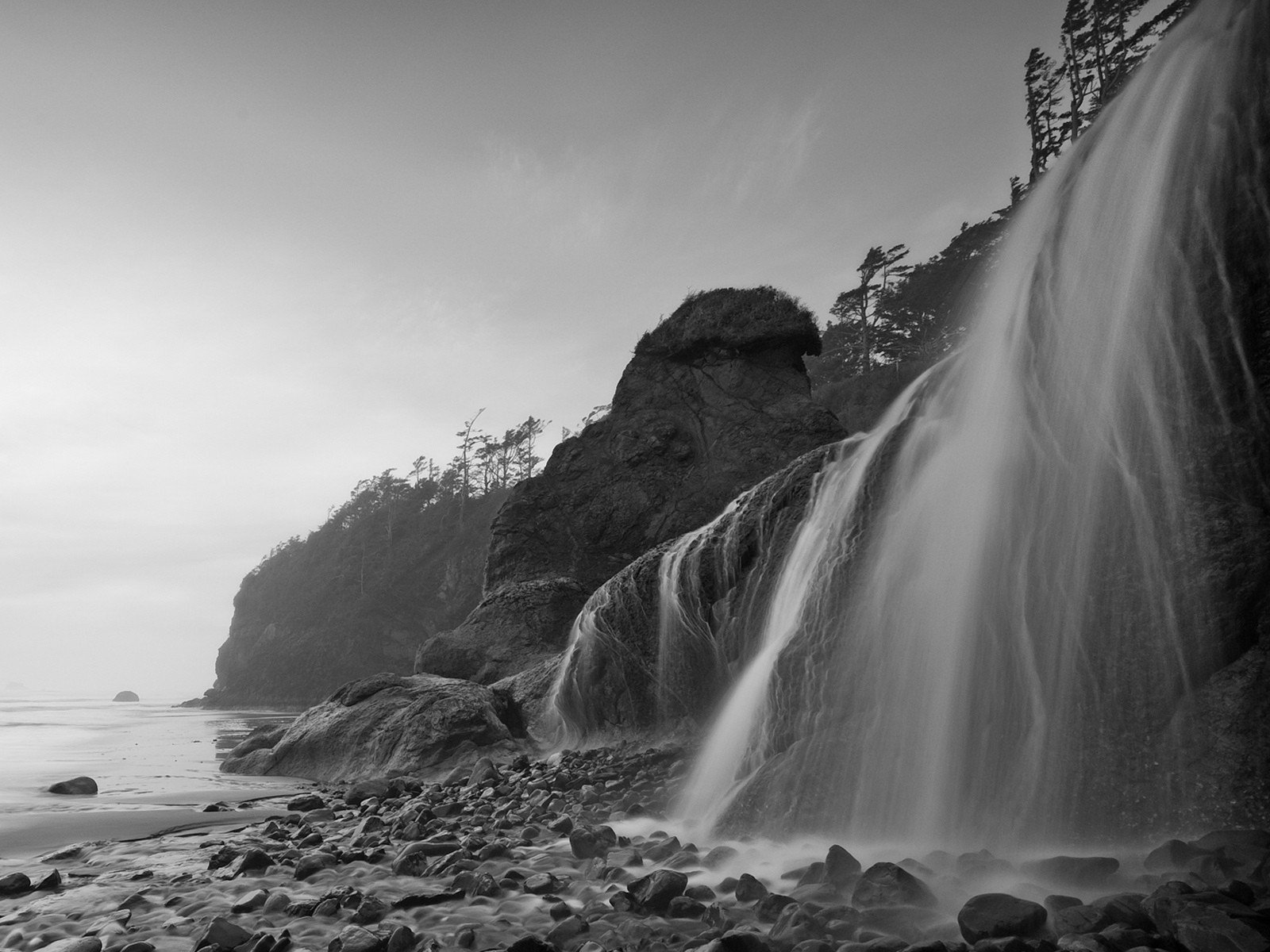 beach sea waterfall black and white stone