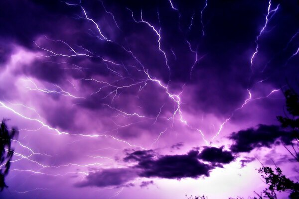 Lightning and clouds in the night sky