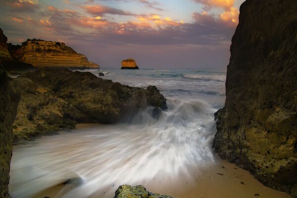 Rocks on the seashore, evening sky