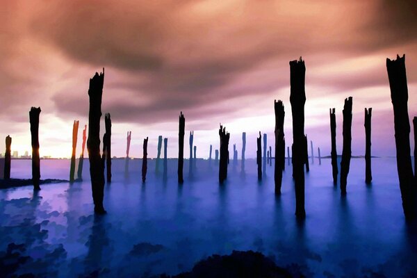 Pillars in the water against a cloudy sky