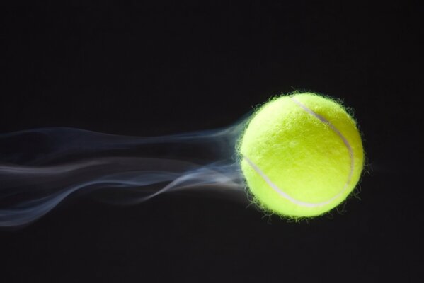 The tennis ball is flying at breakneck speed