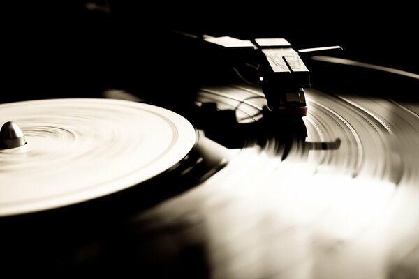 A vinyl record plays music