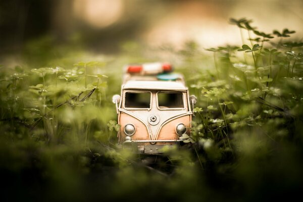 Macro photography of a minibus model in the grass