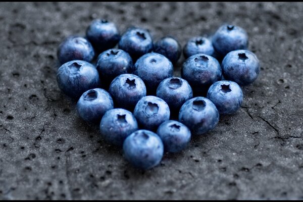 Blueberries are laid out in the shape of a heart