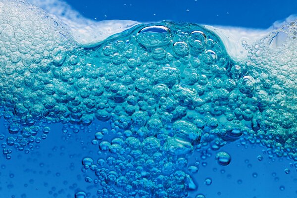 Bubbling blue liquid close-up