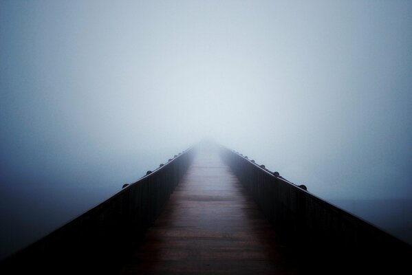 The hazy serenity of an empty bridge