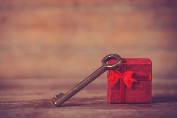 A red box with an old key