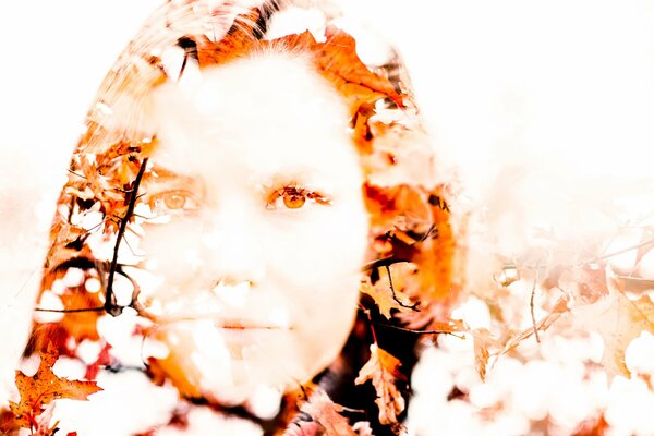 Image of a portrait of a girl with autumn leaves