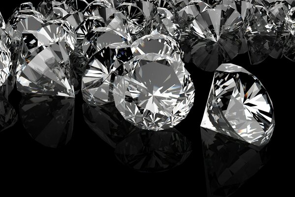 Image of bright large diamonds on a mirrored dark background