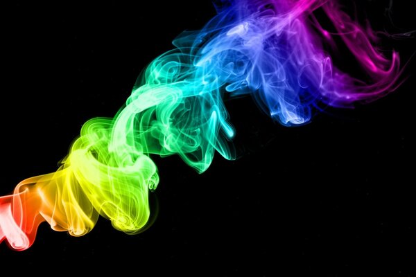 Rainbow-colored smoke on a dark background