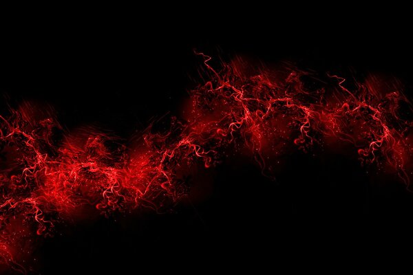 Explosion of red paint on a black background