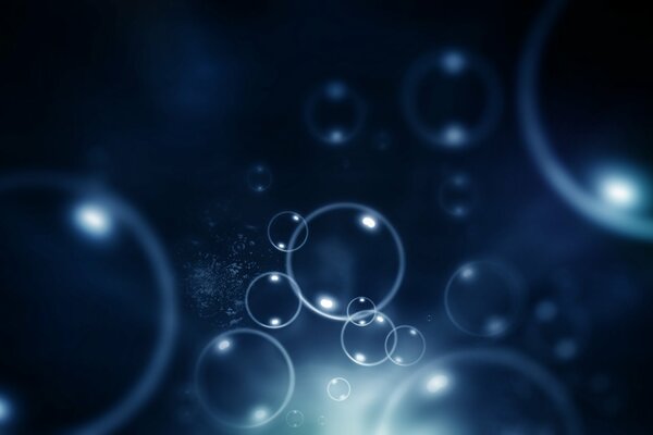 Background soap bubbles on a dark background